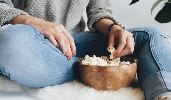Watching movies while eating popcorn
