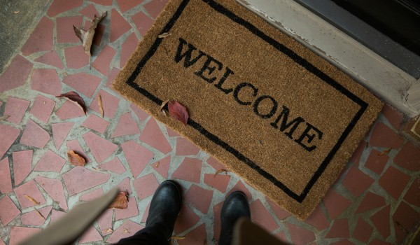 A doormat with the word Welcome on it